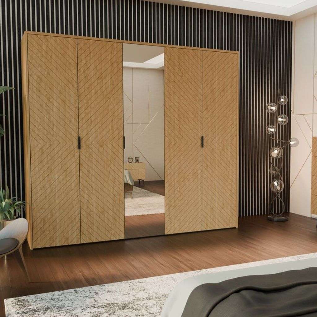 Kler’s elegant wardrobe design featuring wood and mirrored doors, enhancing the room's upscale feel.