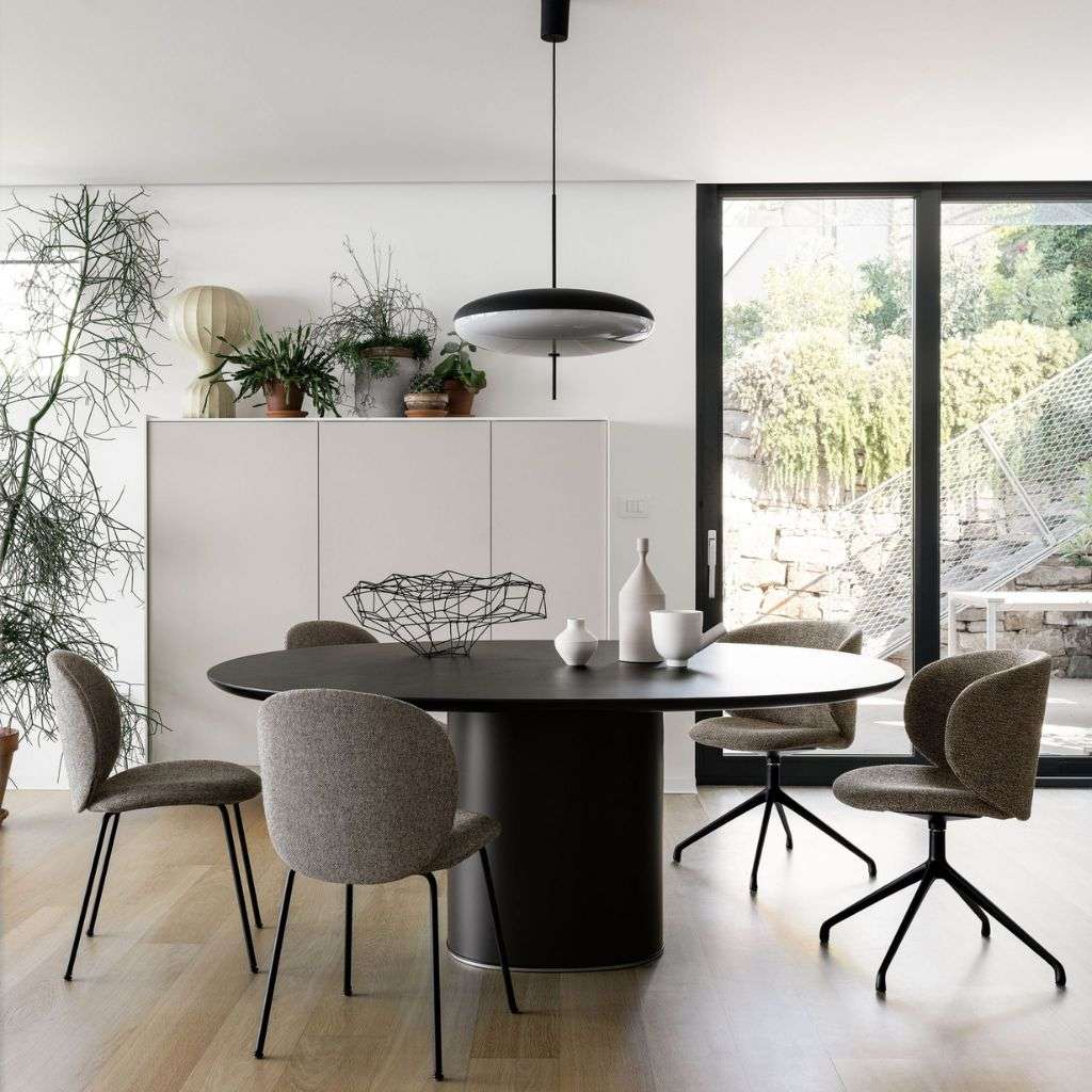 Kristalia dining set with chic, modern chairs and a pendant light