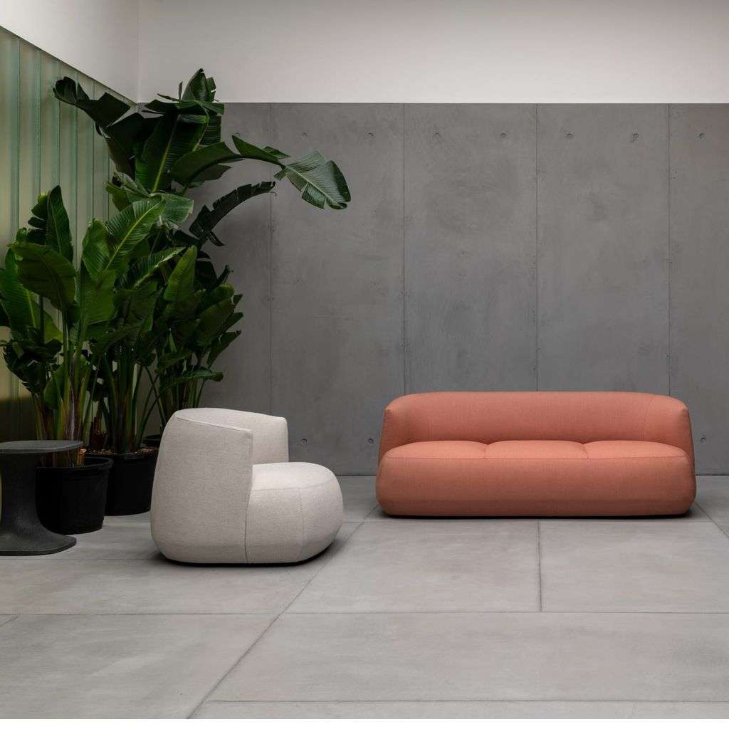 Kristalia lounge chairs and table in a modern interior with a natural ambiance