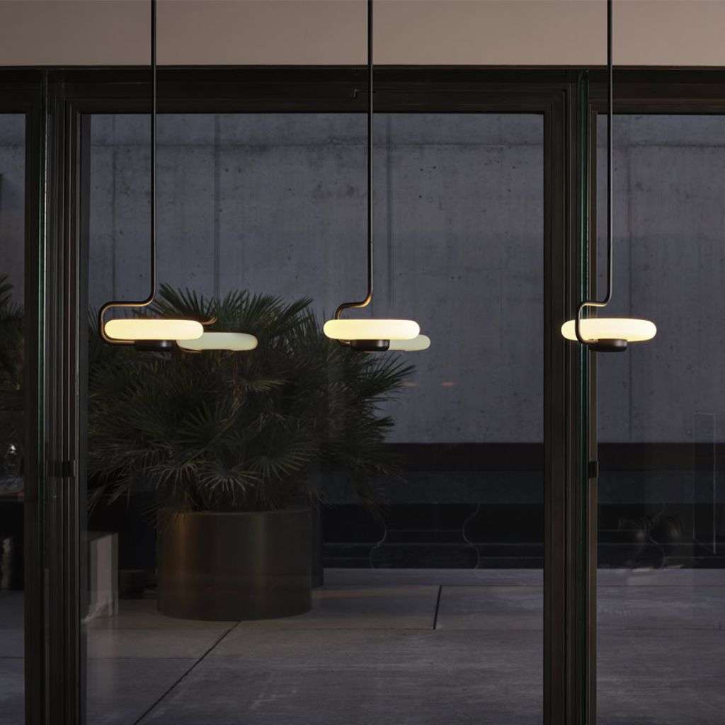 KDLN elongated oval pendants in black, sleek trio by the window.