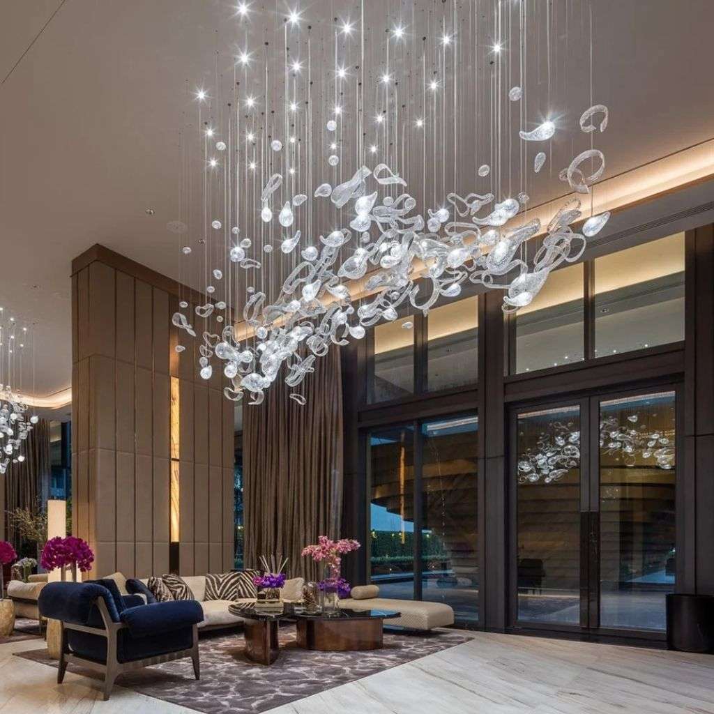 stunning Lasvit chandelier illuminating a luxurious lobby with contemporary elegance.