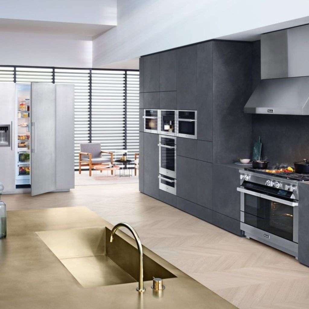 Miele refrigeration and built-in cooking suite in a luxury open-plan kitchen.