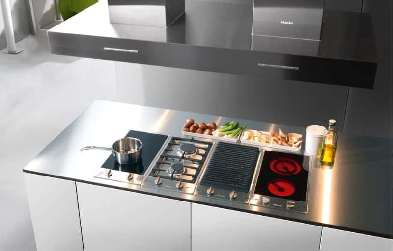Miele modular hob with gas, induction and grill on a stainless worktop.