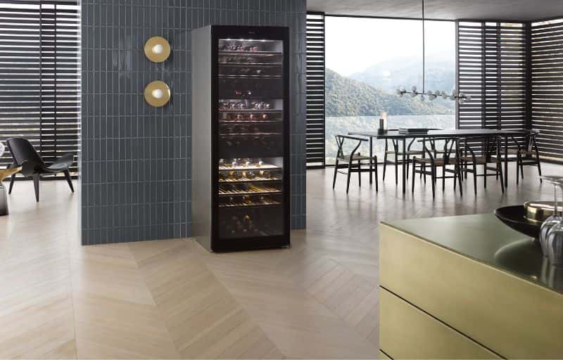 Miele freestanding wine cooler showcased in a contemporary dining space.