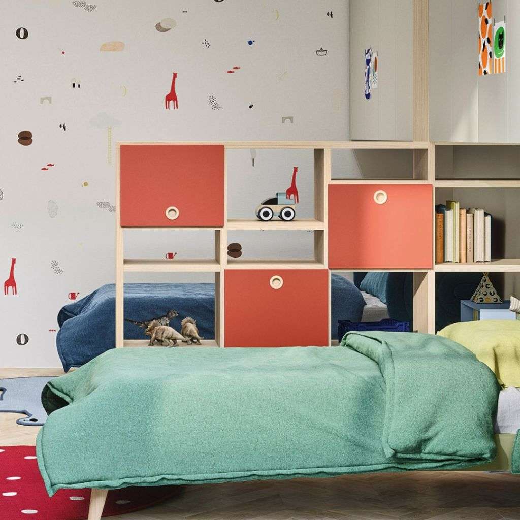 Nidi kids' bedroom with a playful design, showcasing storage units with bold colors and fun décor.