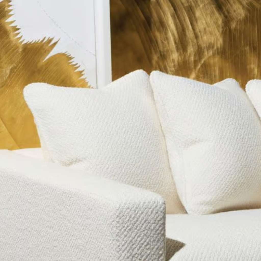 Nobilis white bouclé sofa with plush cushions, combining luxury and comfort.