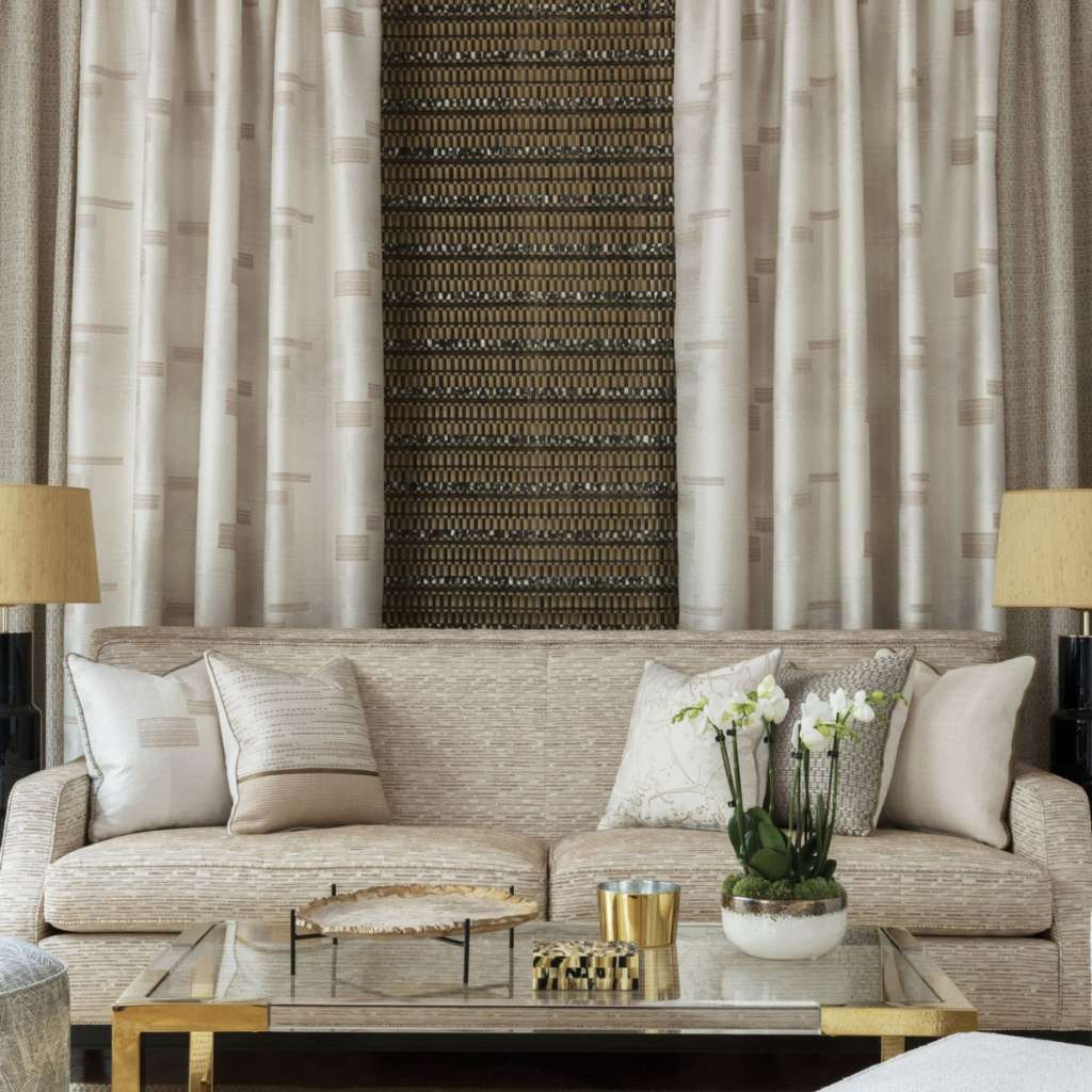 Nobilis elegant sofa with neutral tones, complemented by textured patterned wallpaper for luxury living.