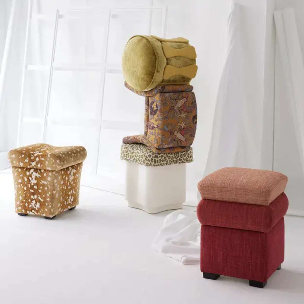 Nobilis eclectic stack of vibrant fabric stools showcasing bold patterns.