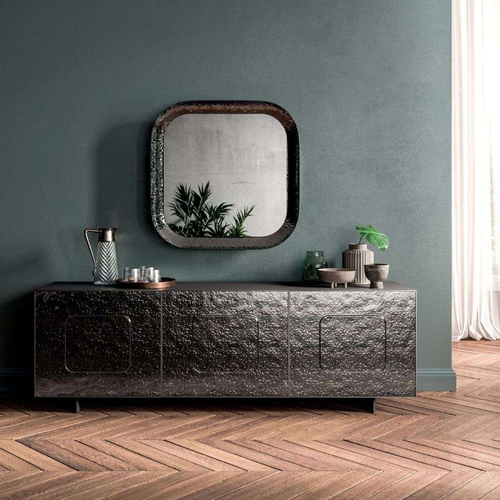 Ozzio Italia's luxurious TV unit and mirror in a sophisticated setting.