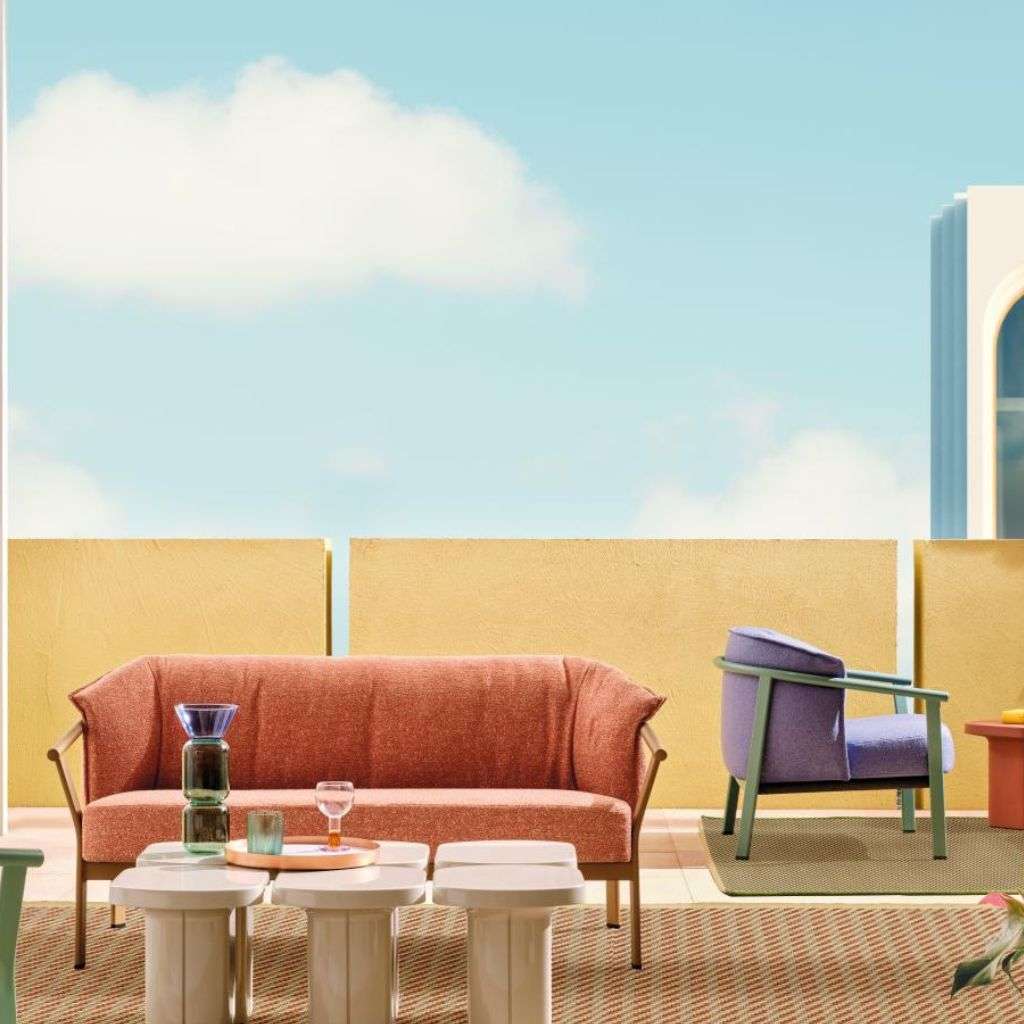 Pedrali vibrant outdoor seating set with modern geometric furniture against a blue sky.