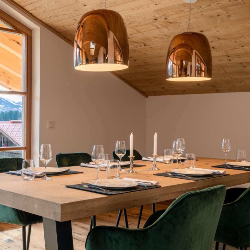 Prandina modern dining table lighting with stylish pendant lamps and elegant atmosphere.