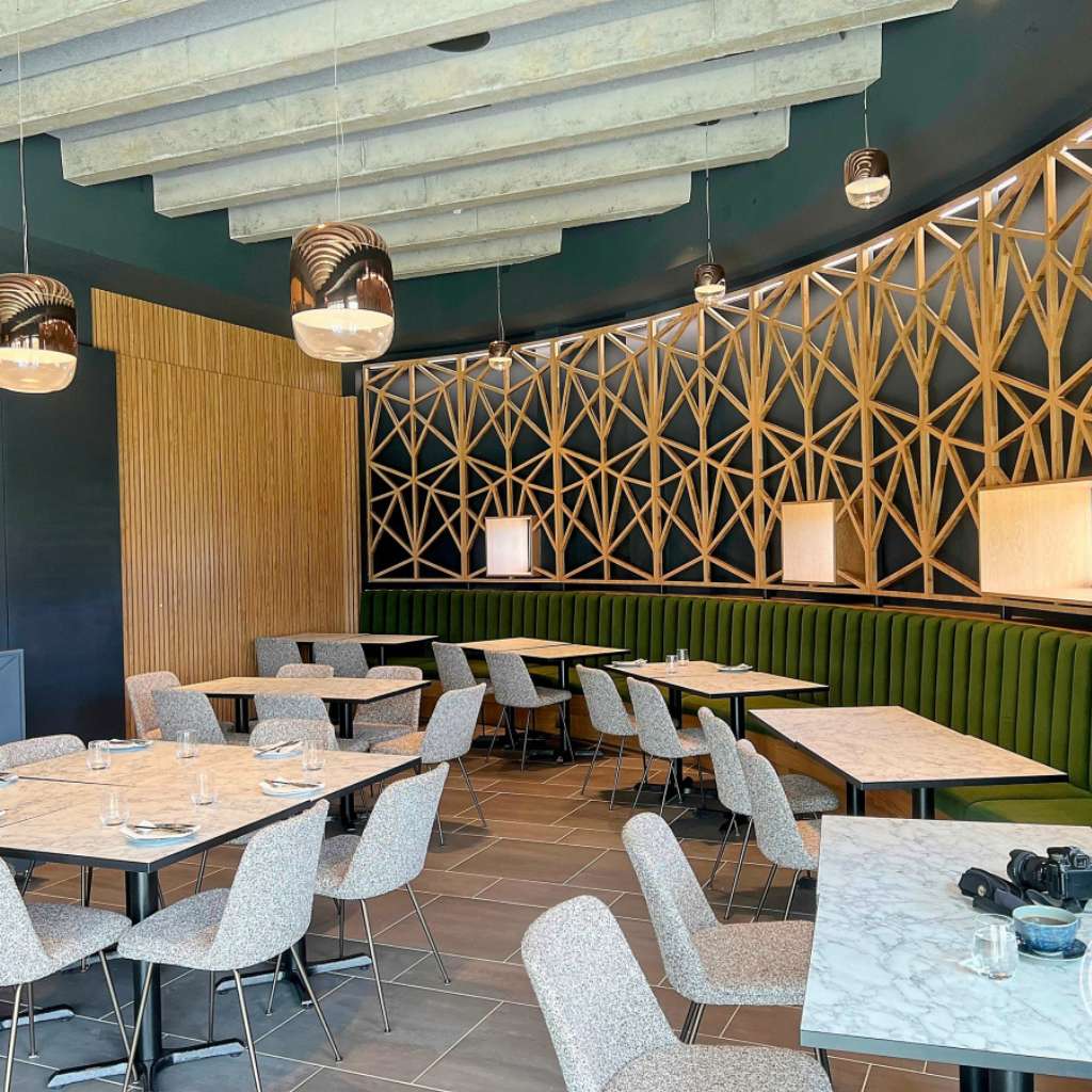 Prandina modern restaurant lighting with elegant design and ambient glow.