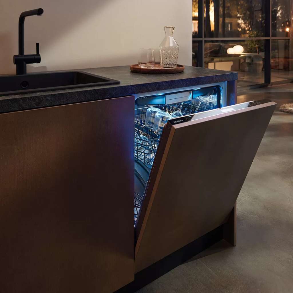 Siemens black dishwasher with sleek design, illuminated interior.