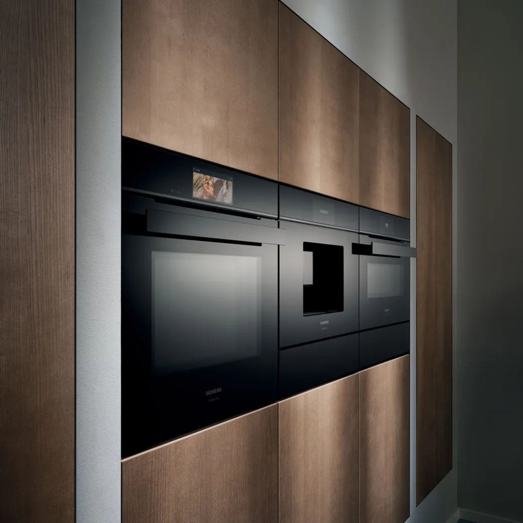 Siemens kitchen with wooden details and integrated appliances.