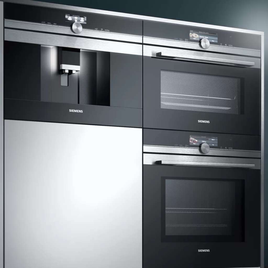 Siemens kitchen featuring black steel appliances and minimalist design.