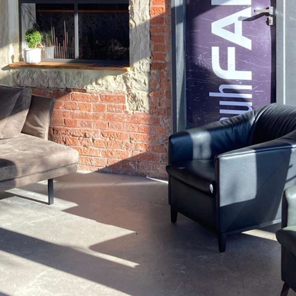 Contemporary lounge setting by Signal Design, perfect for creating a relaxed, chic atmosphere.