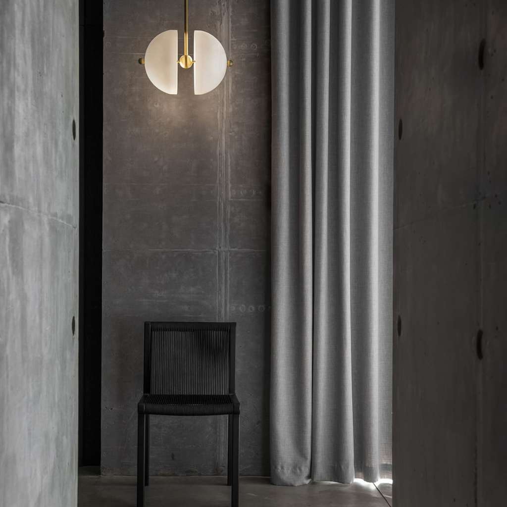 Square In Circle geometric wall light with round and half-disk design.