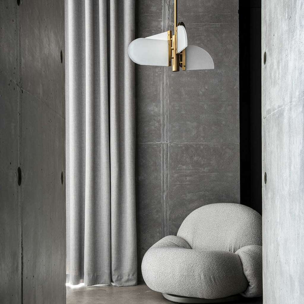 Square In Circle geometric round wall light with brass finish.