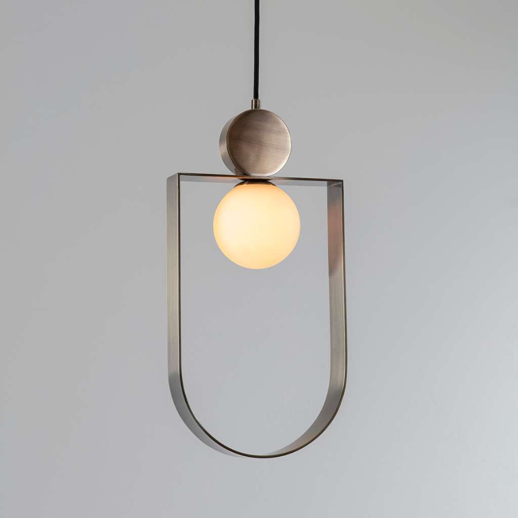 Square In Circle sculptural pendant light with curved gold frame.