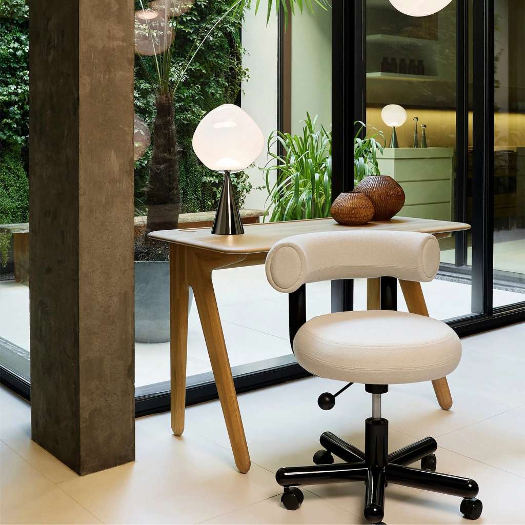 Sleek and ergonomic office chair by Tom Dixon, designed for comfort and style.
