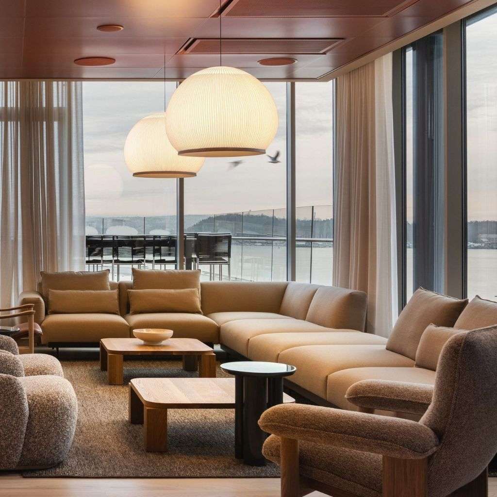 Vibia’s iconic pendant lights adding charm to a luxury living room with sea views