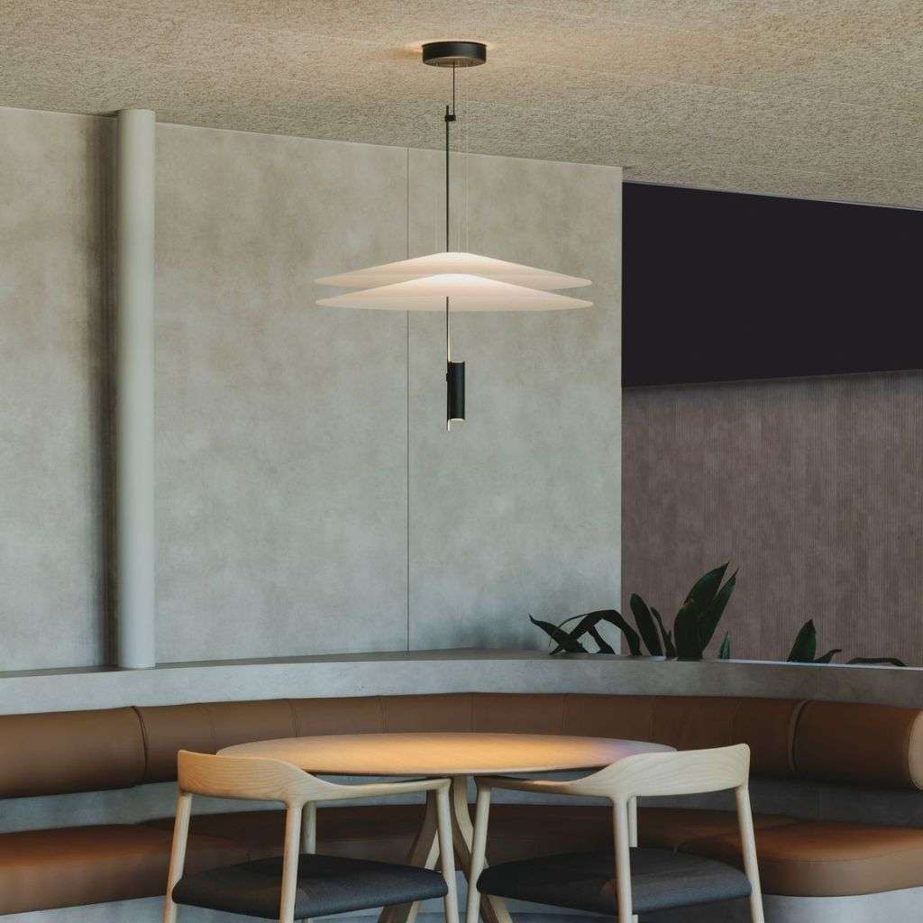 Vibia's sleek pendant light illuminating a cozy dining area with style.