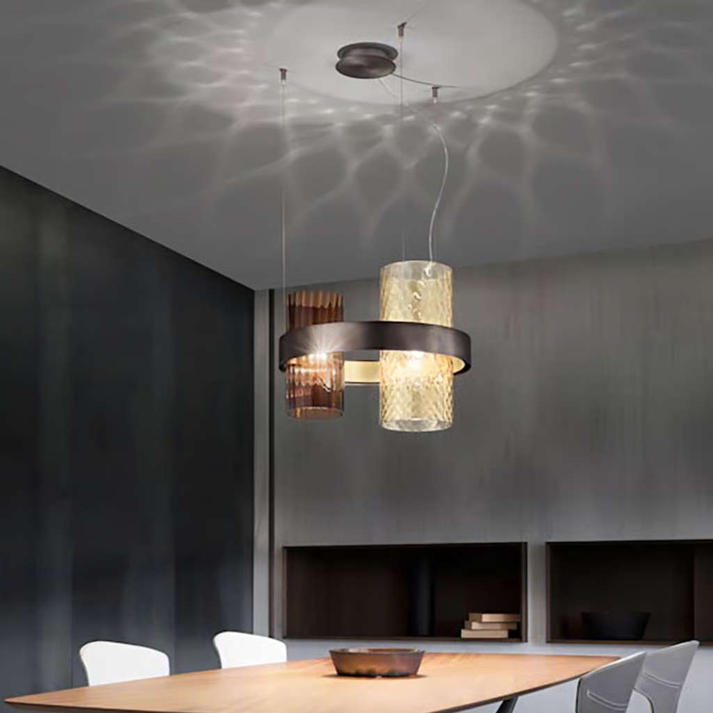 Contemporary pendant light by Vistosi with sculptural design for luxury interiors.