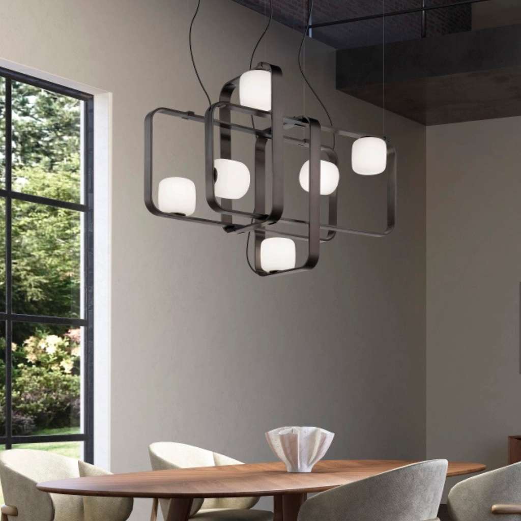 Vistosi dining room with modern pendant lighting, enhancing the elegant ambiance of the space.
