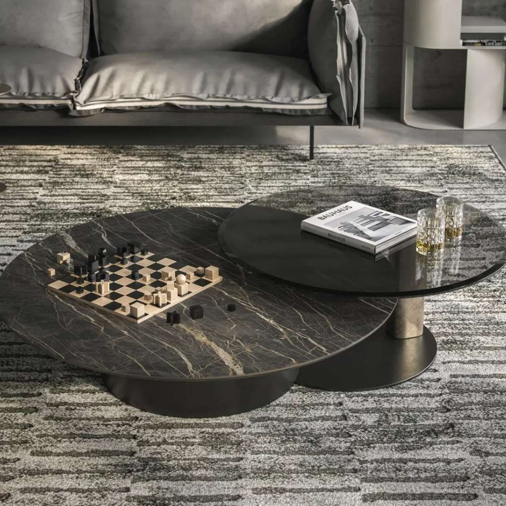 Stunning dark glass and marble coffee table with a metal base and a chessboard on it, adding fun and elegance to the living room.