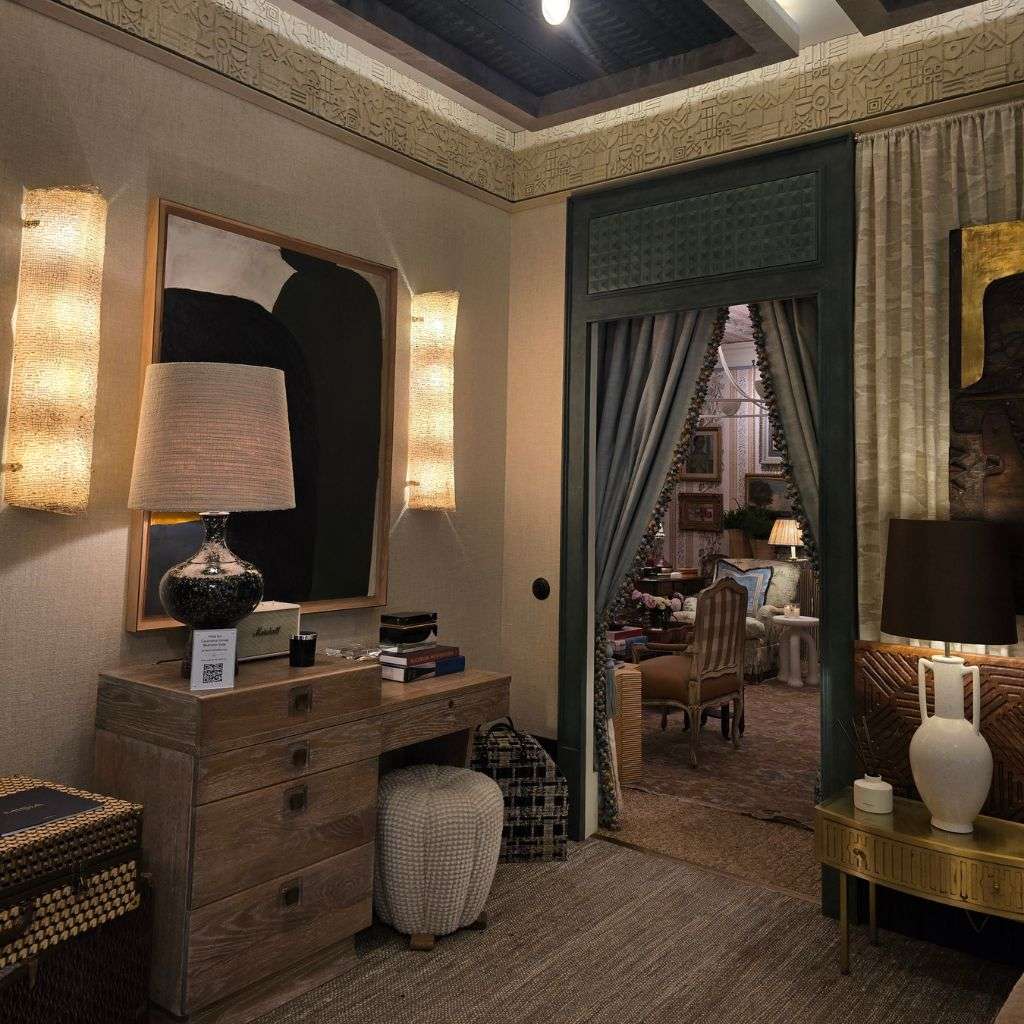 Luxury bedroom with carved wood furniture and verdigris doorway at WOW!house London