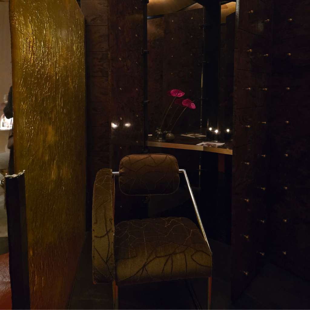 Dark timber panelling with bespoke seating and luxury interior details