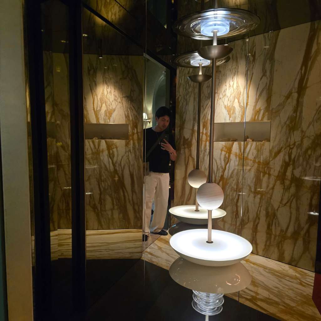 Interior designer exploring hidden alcoves and marble-lined luxury interiors