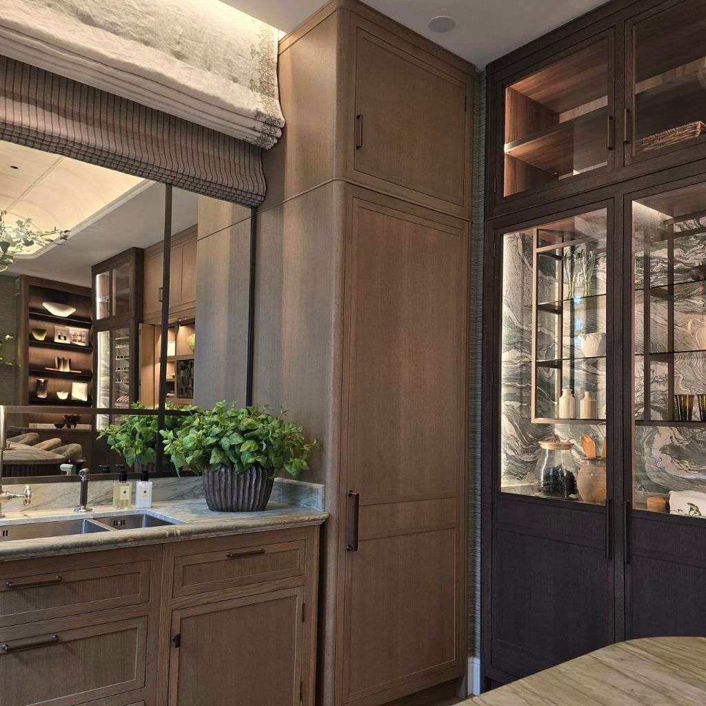 Luxury bathroom with marble archway, illuminated vanity and bespoke interiors