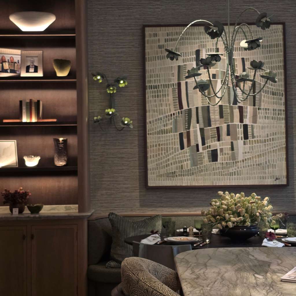 Texture-on-texture interior trend with bespoke shelving, sculptural lighting, marble dining table and artwork