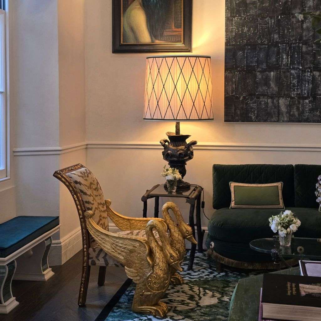 Luxury living room with sculptural swan chair and designer table lamp