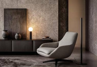 Modern living room corner with stylish lighting fixtures, minimal furniture, and contemporary decor.