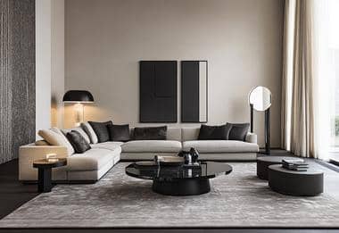 Modern living room with large black rug and light grey sofa.