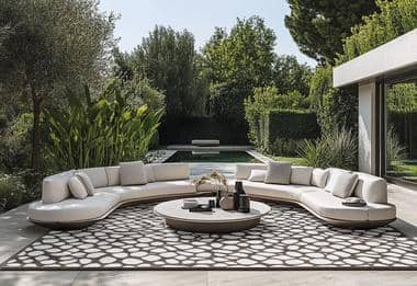 Spacious outdoor seating area with a geometric rug by the pool.