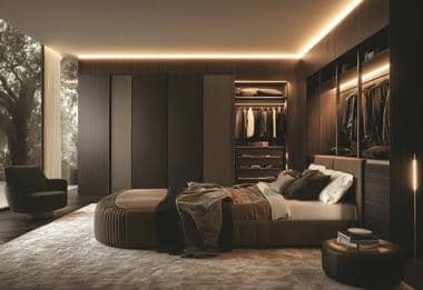 Modern fitted bedroom with dark glass wardrobes and open shelving.