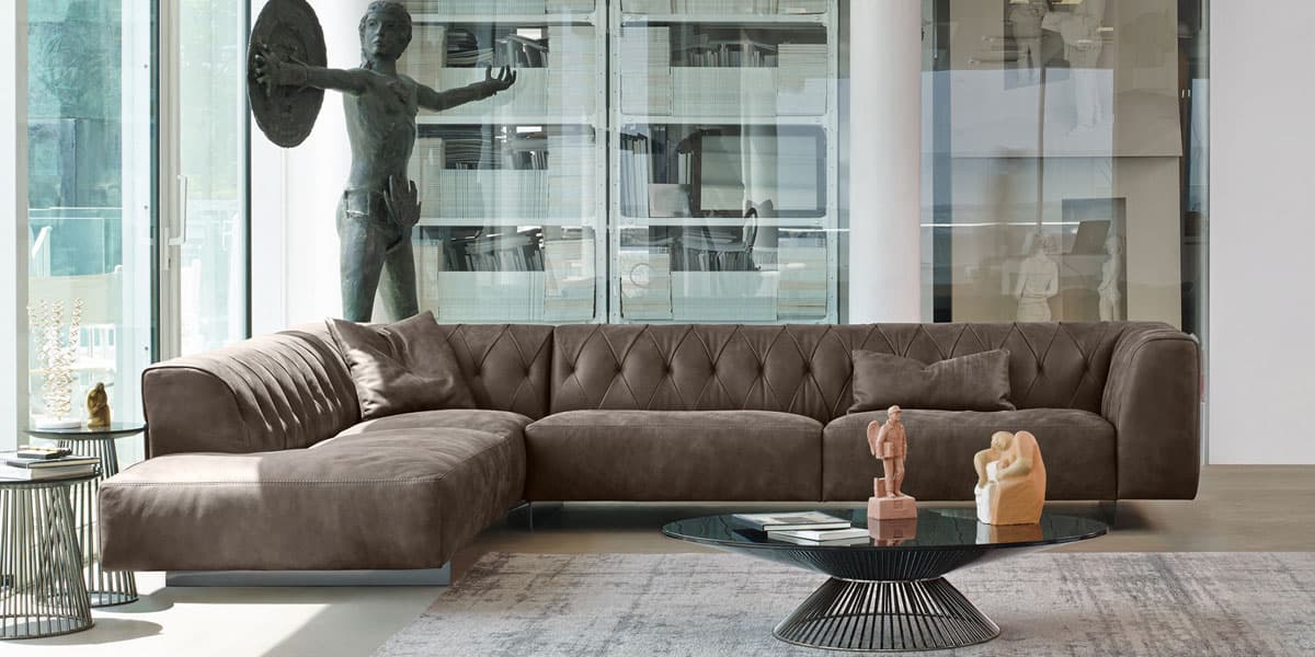 FCI London curved statement sofa in velvet; sculptural form elevates modern living rooms.