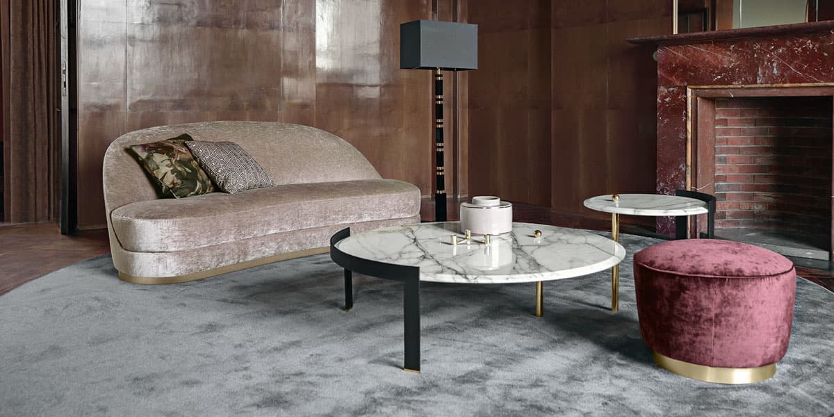 FCI London statement sofa with channel tufting; bold silhouette for modern living rooms.