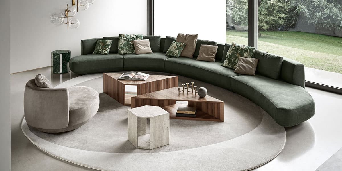 FCI London statement sofa with contrasting piping and plush cushions; design-led look.