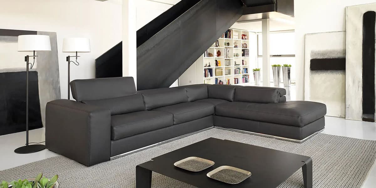 FCI London sofa with sculptural arms and deep cushions; a statement for modern spaces.
