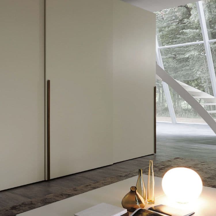 Luxury bedroom with fitted wardrobes showing different door materials