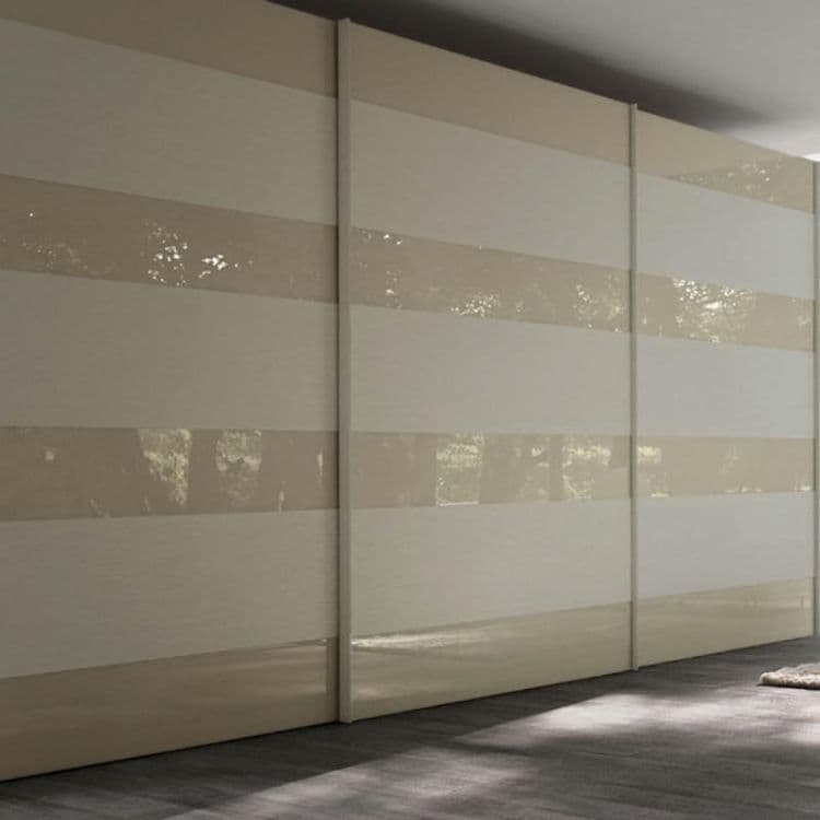 Close-up of fitted wardrobe base meeting carpet with professional finish