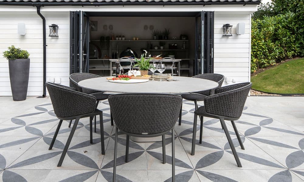 FCI London festive dining table ideas: greenery, charger plates and tonal linens.