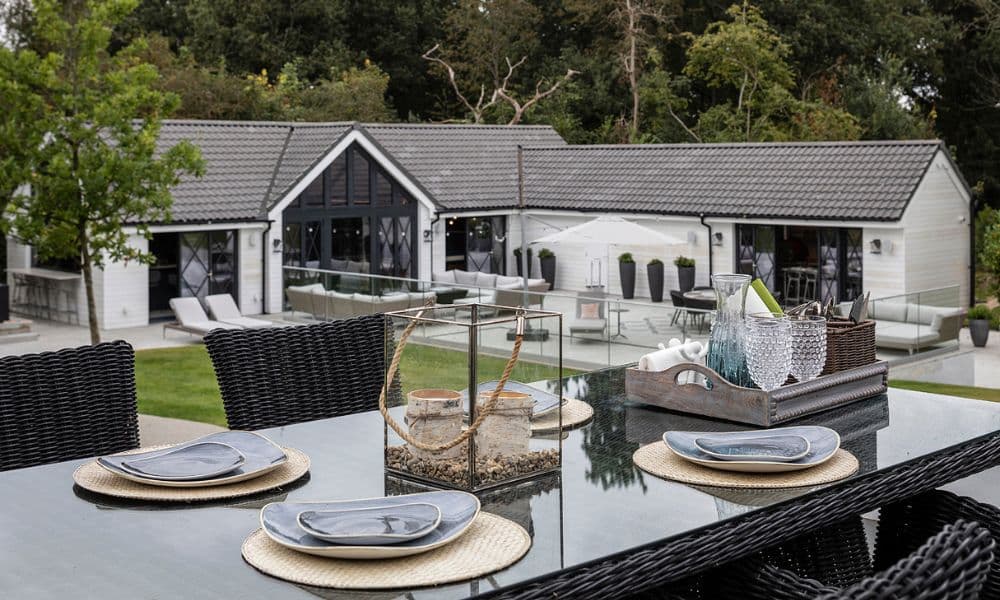 FCI London festive dining table ideas: layered plates, napkin rings and subtle greenery.