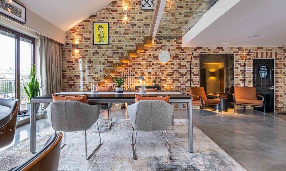 FCI London marble dining table styling with neutral linens and gold cutlery.