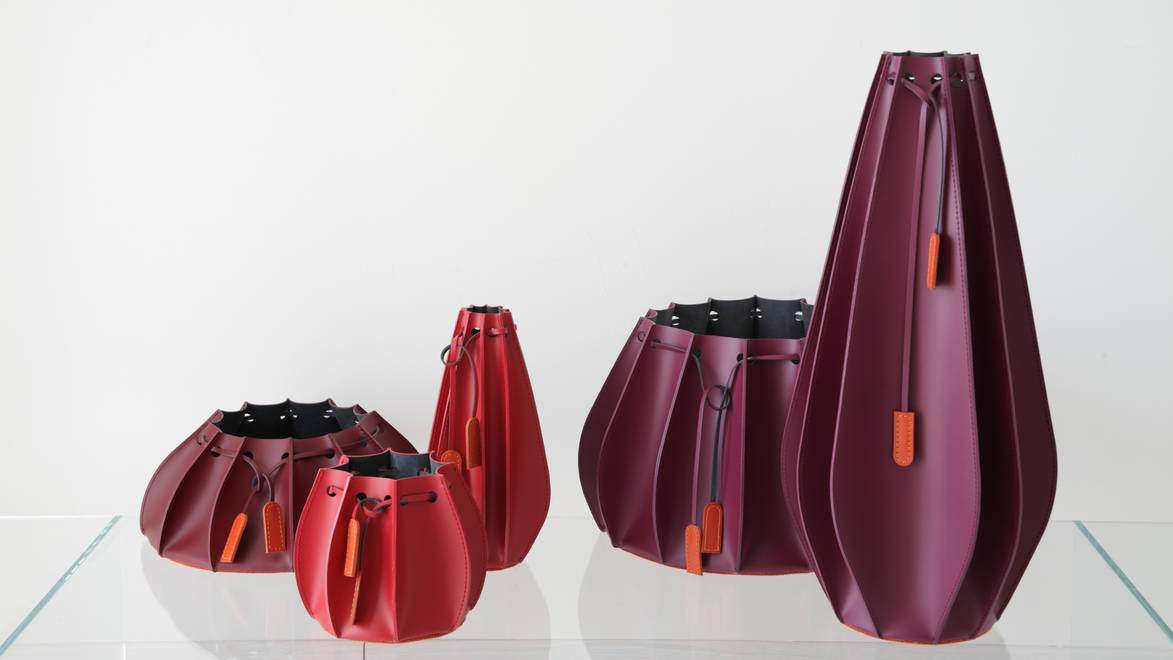 FCI London round dining table decor: floral centrepiece and balanced place settings.