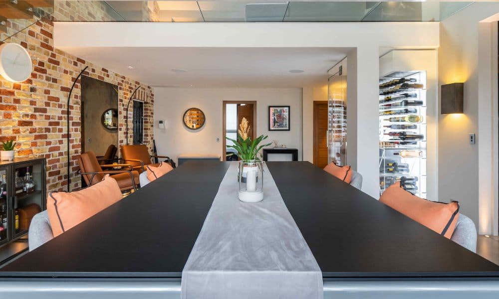 FCI London round dining table styling with candles, florals and refined place settings.